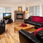 Mustang Run - Living Room with gas log fireplace, cozy leather couches & recliner