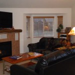 Quail Run 806 - Living room with new 55" TV & new leather couch that folds out into a sofa sleeper Quail Run 806 - Living room with new 55" TV & new leather couch that folds out into a sofa sleeper